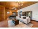 Spacious living room featuring modern furnishings, wood paneled walls, and tile floors at 4095 E Highway 166 Hwy, Carrollton, GA 30116