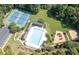 Aerial view featuring the pool, tennis courts, and playground in a meticulously landscaped community at 4842 Registry Nw Dr, Kennesaw, GA 30152