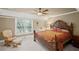 Comfortable bedroom with large windows, sitting area, and a king-size bed at 4842 Registry Nw Dr, Kennesaw, GA 30152