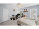 Inviting bedroom with a ceiling fan, comfortable furniture, and views from two large windows at 4842 Registry Nw Dr, Kennesaw, GA 30152