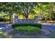 Stone community sign with lush landscaping welcomes residents to Burnt Hickory Registry at 4842 Registry Nw Dr, Kennesaw, GA 30152