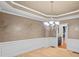 A formal dining area featuring elegant lighting, paint, and a glimpse into a nearby room at 4842 Registry Nw Dr, Kennesaw, GA 30152
