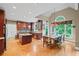 Spacious dining area with a large table, hardwood floors, and bright natural light at 4842 Registry Nw Dr, Kennesaw, GA 30152
