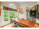 Bright dining room with a view of the living room and backyard foliage at 4842 Registry Nw Dr, Kennesaw, GA 30152