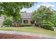 Charming two-story home with brick facade, manicured landscaping, and inviting front porch at 4842 Registry Nw Dr, Kennesaw, GA 30152