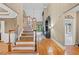 Grand foyer with high ceilings, hardwood floors, and a staircase leading to the upper level at 4842 Registry Nw Dr, Kennesaw, GA 30152