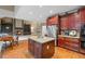Open-concept kitchen with granite countertops, stainless steel appliances, and island seating at 4842 Registry Nw Dr, Kennesaw, GA 30152