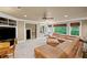 Basement living room features a large leather sectional, built in shelving and 3 large windows at 4842 Registry Nw Dr, Kennesaw, GA 30152