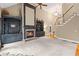 Bright living room featuring a fireplace, custom built-ins, high ceilings, and a staircase at 4842 Registry Nw Dr, Kennesaw, GA 30152
