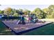 Community playground with slides, climbing structures, and a soft mulch surface at 4842 Registry Nw Dr, Kennesaw, GA 30152