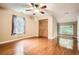 Spacious bedroom with hardwood floors, windows, and a closet at 510 Aiken Dr, Dallas, GA 30157