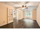 Spacious bonus room with hardwood floors, ceiling fans, and French doors, offering versatility for any lifestyle at 510 Aiken Dr, Dallas, GA 30157