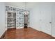 Charming dining room featuring hardwood floors, decorative wallpaper, and chandelier lighting at 510 Aiken Dr, Dallas, GA 30157