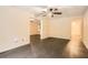 Spacious living room with hardwood floors and neutral walls, enhanced by natural light and a ceiling fan at 510 Aiken Dr, Dallas, GA 30157