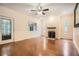 Bright living room features hardwood floors, a fireplace, and a stylish glass-paneled door at 510 Aiken Dr, Dallas, GA 30157