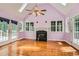 Inviting living room with a fireplace, skylights, and access to the deck at 510 Aiken Dr, Dallas, GA 30157