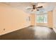 Bright room featuring dark wood floors, a large window, and access to the exterior at 510 Aiken Dr, Dallas, GA 30157