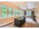 Daytime shot of sunroom featuring multiple windows, neutral walls and carpet, and ceiling fans at 510 Aiken Dr, Dallas, GA 30157