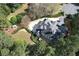 Expansive home featuring manicured landscaping, circular driveway, and fountain, nestled in a lush, green lot at 5360 Northwater Way, Duluth, GA 30097