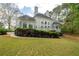 Back exterior view of the house with a deck at 5360 Northwater Way, Duluth, GA 30097