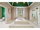 Bright bathroom showcases a jacuzzi tub, a glass-enclosed shower and toilet room behind a patterned door at 5360 Northwater Way, Duluth, GA 30097