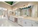 Spacious bathroom with double sinks, marble countertops, and a soaking tub with lots of natural light at 5360 Northwater Way, Duluth, GA 30097
