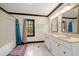 Bathroom with dual vanities, shower and tub, and window at 5360 Northwater Way, Duluth, GA 30097