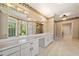 Elegant bathroom with dual sinks, vanity, and large mirrors, offering a luxurious feel at 5360 Northwater Way, Duluth, GA 30097