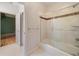 Bright bathroom featuring a shower/tub combination with glass doors and decorative tile at 5360 Northwater Way, Duluth, GA 30097