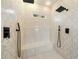 Walk-in shower with dual shower heads and elegant marble tile at 5360 Northwater Way, Duluth, GA 30097