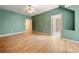 Green spare bedroom with hardwood floors and ample natural light at 5360 Northwater Way, Duluth, GA 30097