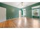 Neutral spare bedroom with hardwood floors, ample natural light, and a ceiling fan at 5360 Northwater Way, Duluth, GA 30097