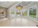 Sun-filled breakfast nook with large windows overlooking the backyard, and a decorative chandelier at 5360 Northwater Way, Duluth, GA 30097
