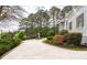 Circular driveway with statue and landscaped bushes at 5360 Northwater Way, Duluth, GA 30097