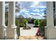 View from the front porch showcasing the circular driveway, statue, and mature landscaping of the property at 5360 Northwater Way, Duluth, GA 30097