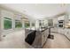 Open-concept kitchen and breakfast nook area with a large island, white cabinets, and stainless steel appliances at 5360 Northwater Way, Duluth, GA 30097
