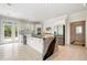 Modern kitchen featuring a large island with granite countertops, white cabinets, and stainless steel appliances at 5360 Northwater Way, Duluth, GA 30097