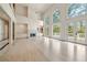Open and airy living room with large windows and fireplace at 5360 Northwater Way, Duluth, GA 30097