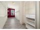 Organized walk-in closet with shelving, hanging rods, and a built-in mirror at 5360 Northwater Way, Duluth, GA 30097