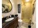 Bathroom with granite vanity, glass shower, and modern fixtures at 910 Kings Arms Way, Alpharetta, GA 30022