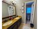 Bathroom features a double sink vanity with granite countertops at 910 Kings Arms Way, Alpharetta, GA 30022