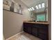 Bathroom features a granite countertop double sink vanity at 910 Kings Arms Way, Alpharetta, GA 30022