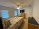 Well-lit bedroom boasts neutral decor, soft bedding, and an inviting ambiance at 910 Kings Arms Way, Alpharetta, GA 30022