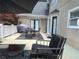 A well-furnished deck area with a dining table set, comfortable seating, and a stylish outdoor rug, perfect for relaxation and entertaining at 910 Kings Arms Way, Alpharetta, GA 30022