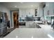 Modern kitchen featuring stainless steel appliances, white cabinets, and a tile backsplash at 910 Kings Arms Way, Alpharetta, GA 30022