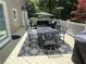 Patio features a dining table with seating for eight, a grill and patio furniture at 910 Kings Arms Way, Alpharetta, GA 30022