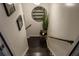 View down the stairway featuring dark hardwood steps and black handrails at 910 Kings Arms Way, Alpharetta, GA 30022