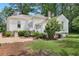 Beautiful home with a stone foundation, landscaped yard, and multiple exterior access points at 95 Whitlock Sw Ave, Marietta, GA 30064