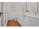 Elegant bathroom with double vanities, modern fixtures, and a glass-enclosed shower at 95 Whitlock Sw Ave, Marietta, GA 30064
