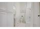 Charming bathroom with a pedestal sink, bathtub and shower, and built-in linen closet at 95 Whitlock Sw Ave, Marietta, GA 30064